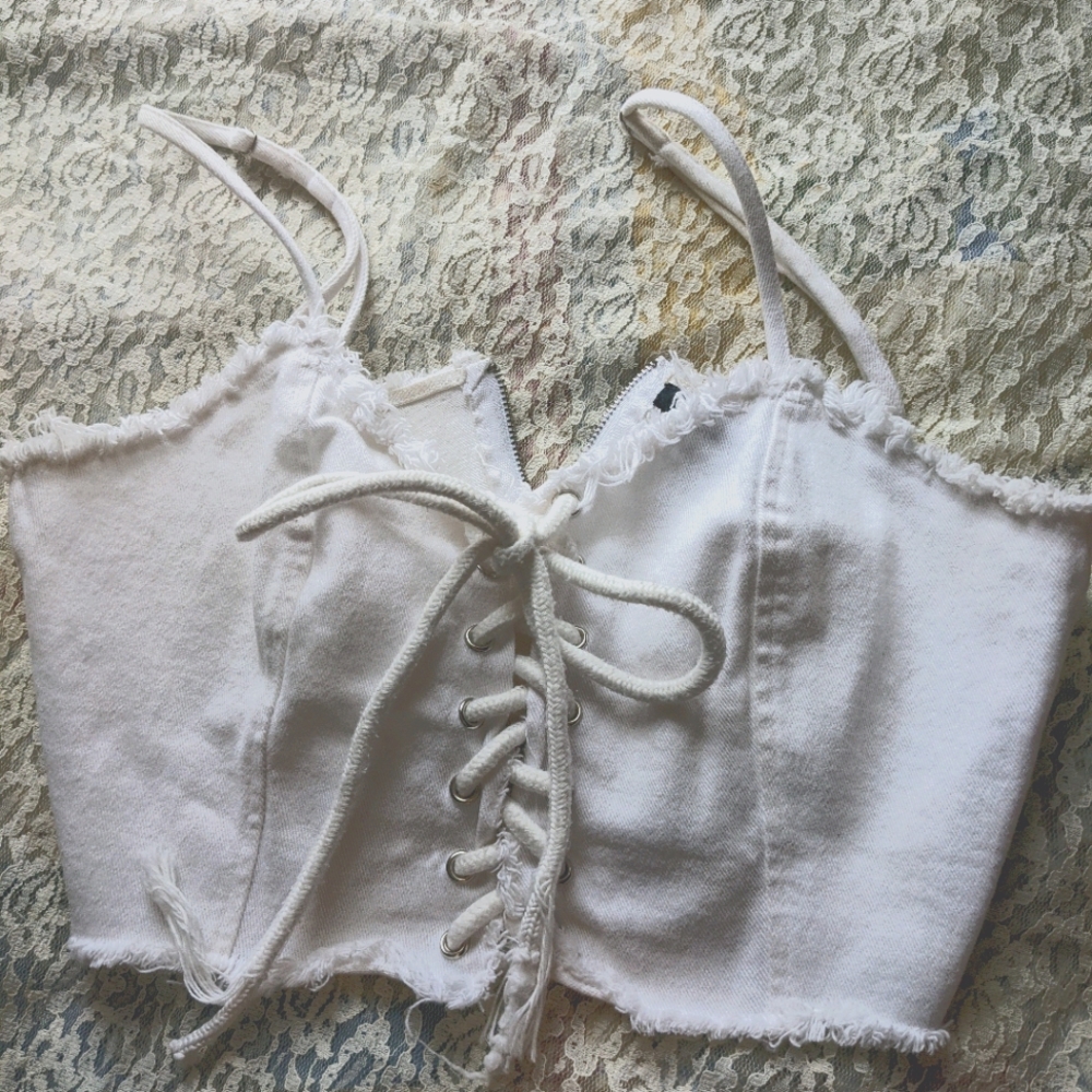Lace-up front white crop top.